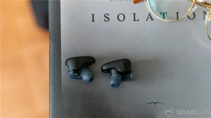 Sony WF-SP800N earbuds on a magazine.